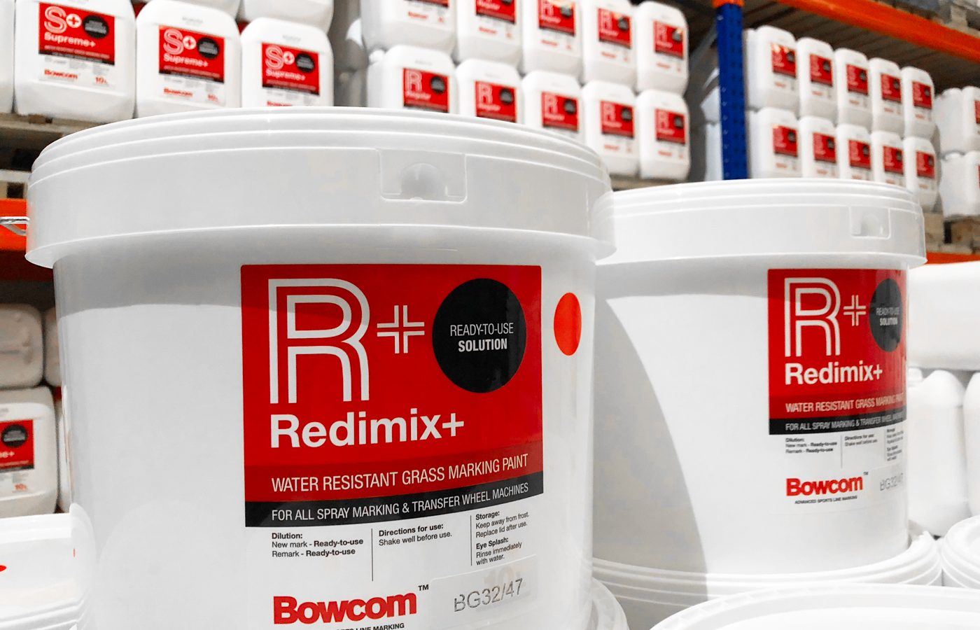 Bowcom packaging design on multiple white tubs in a warehouse by celf creative