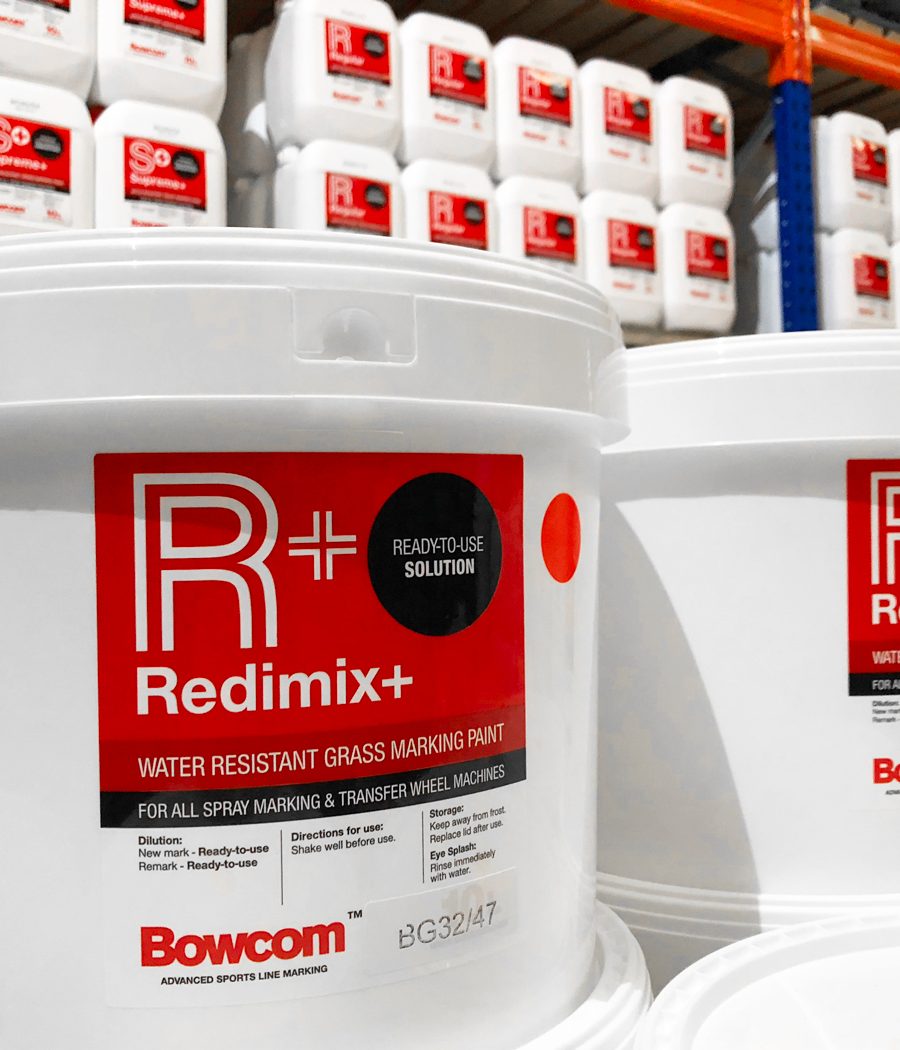 Bowcom packaging design on multiple white tubs in a warehouse by celf creative